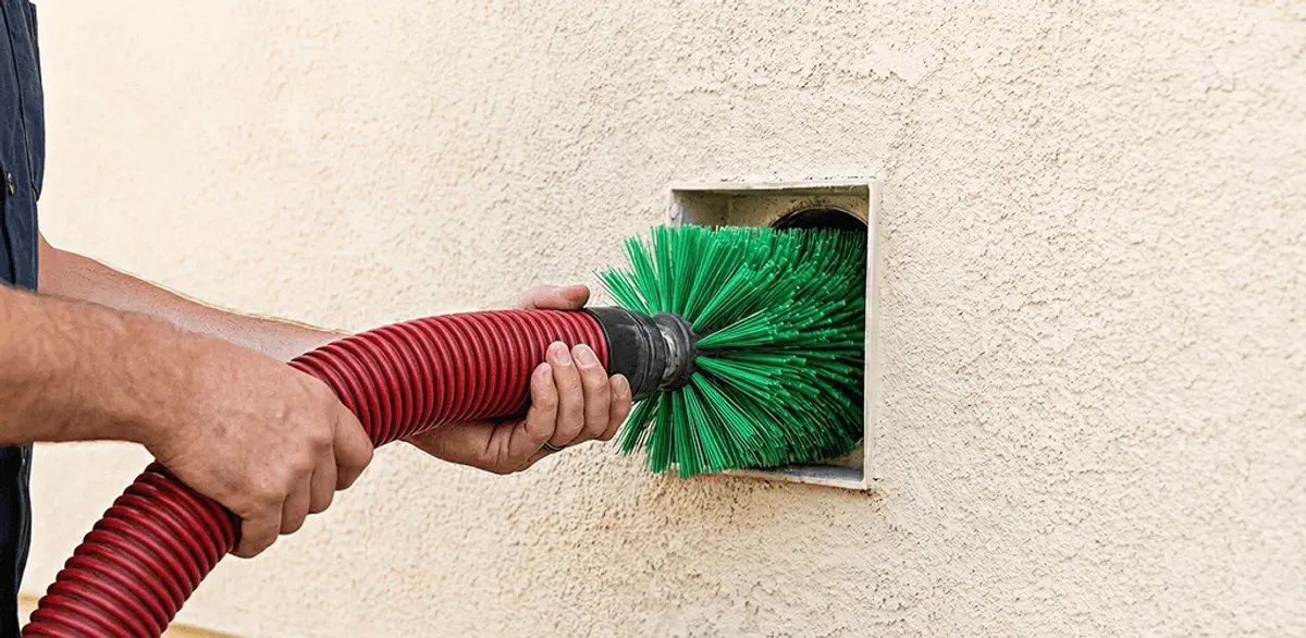 Air duct cleaning brush removing debris from a vent opening in Minneapolis, MN