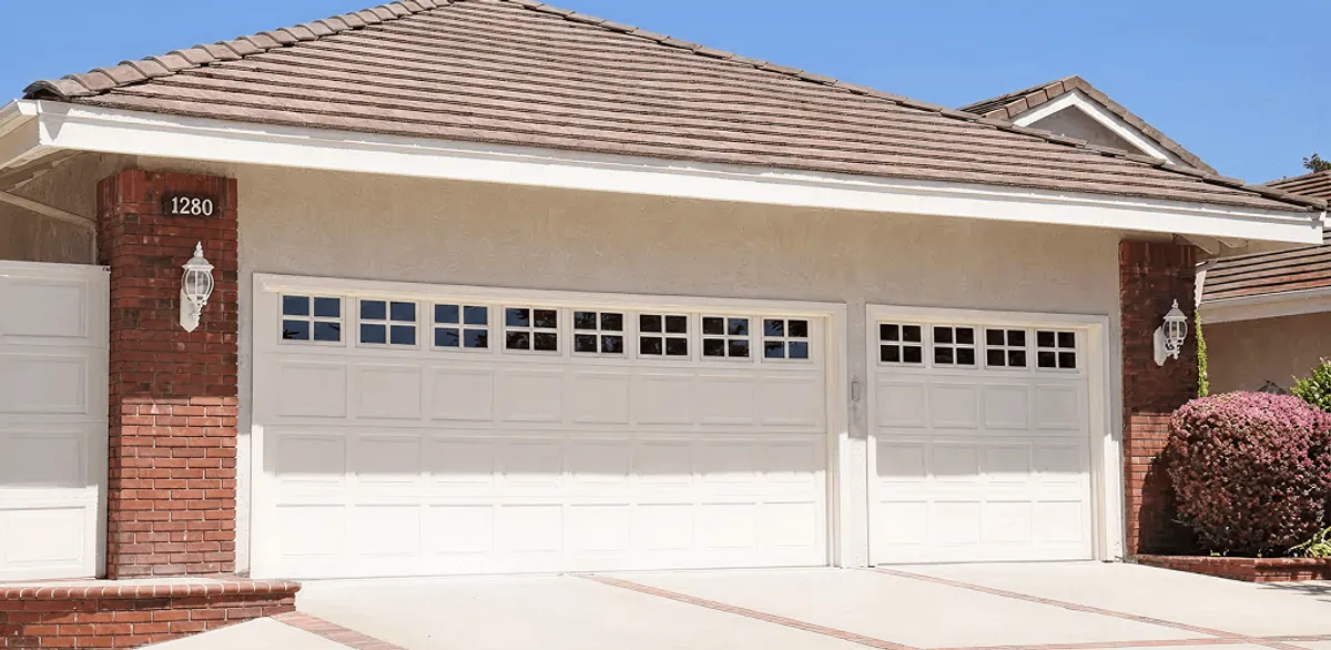 Residential garage door repair service for a double garage door in Minneapolis, MN