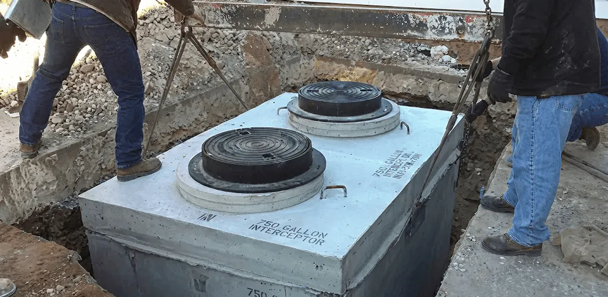 Grease trap installation for a commercial property drainage system in Minneapolis, MN