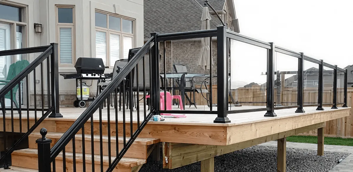 Handrail installation on a deck staircase for safety and code compliance in Minneapolis, MN